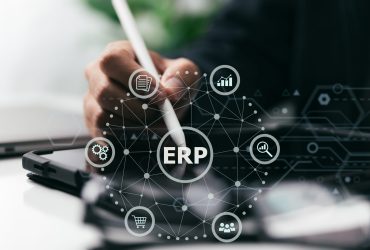 A businessman uses a computer to organize documents for ERP. The concept of enterprise resource planning.